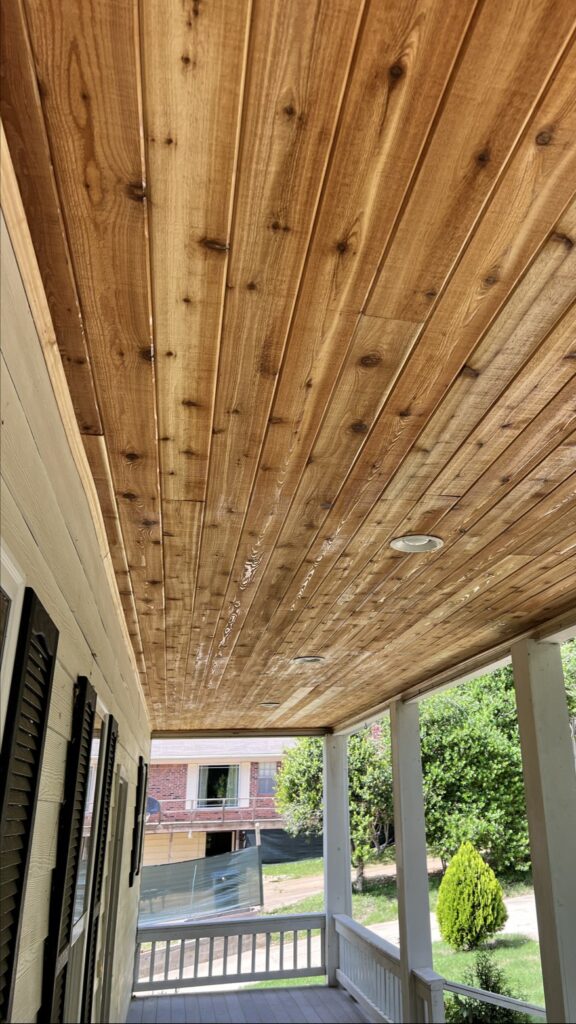 Covered porch with tongue-and-groove wood ceiling